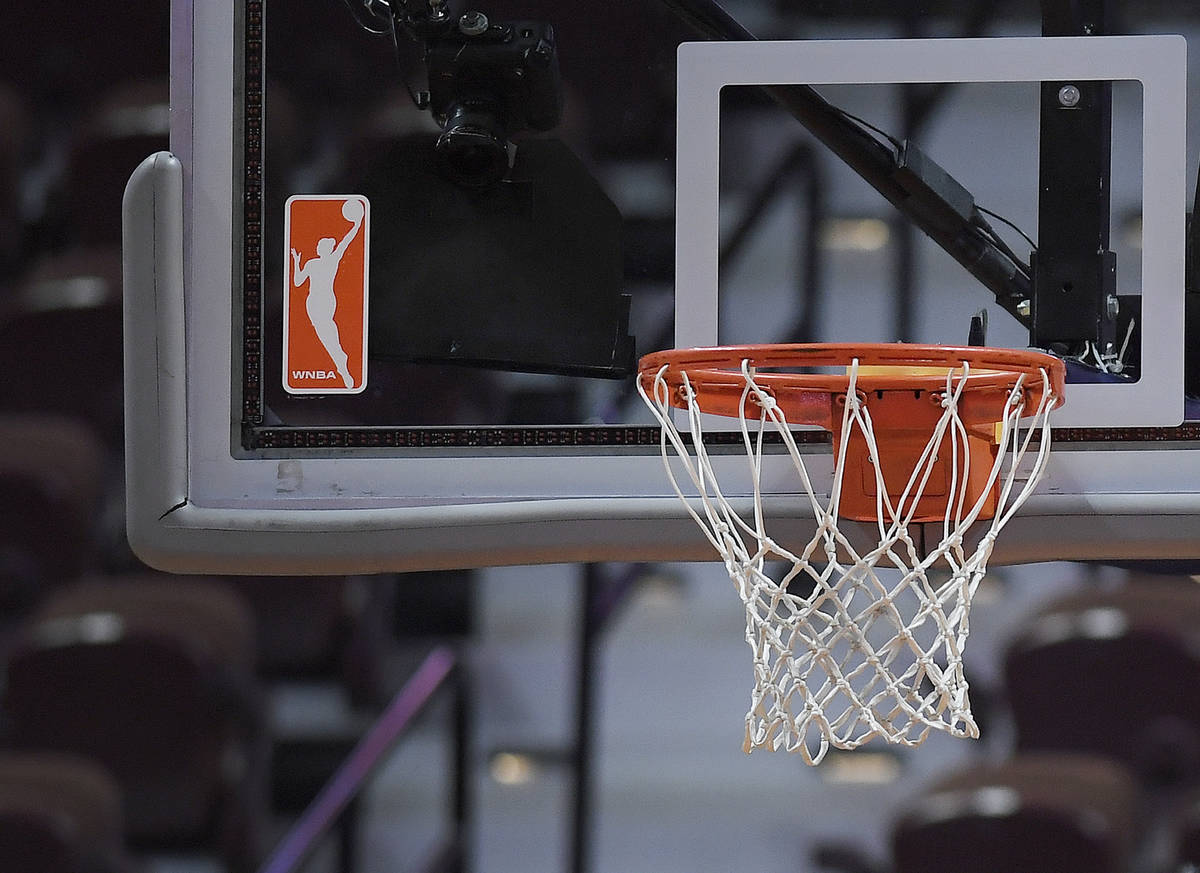 The WNBA logo and hoop are seen at a WNBA basketball game at Mohegan Sun Arena, Tuesday, May 14 ...