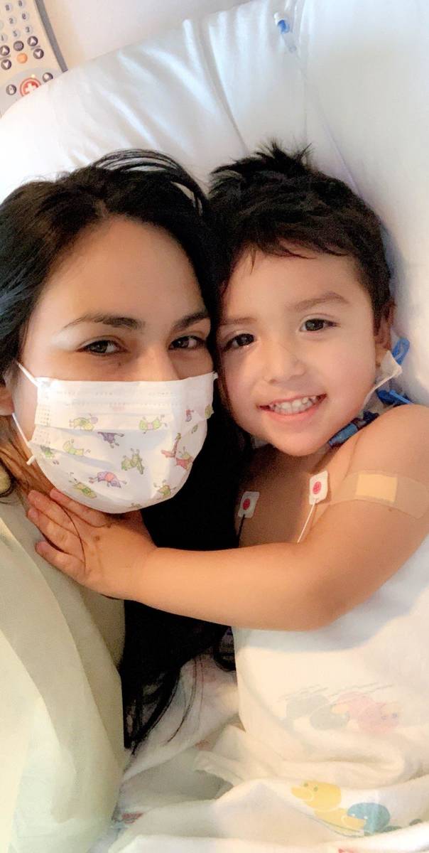 Karen Sombra cuddles Thursday with son Sebastian Rodriguez in the intensive care unit at Sunris ...