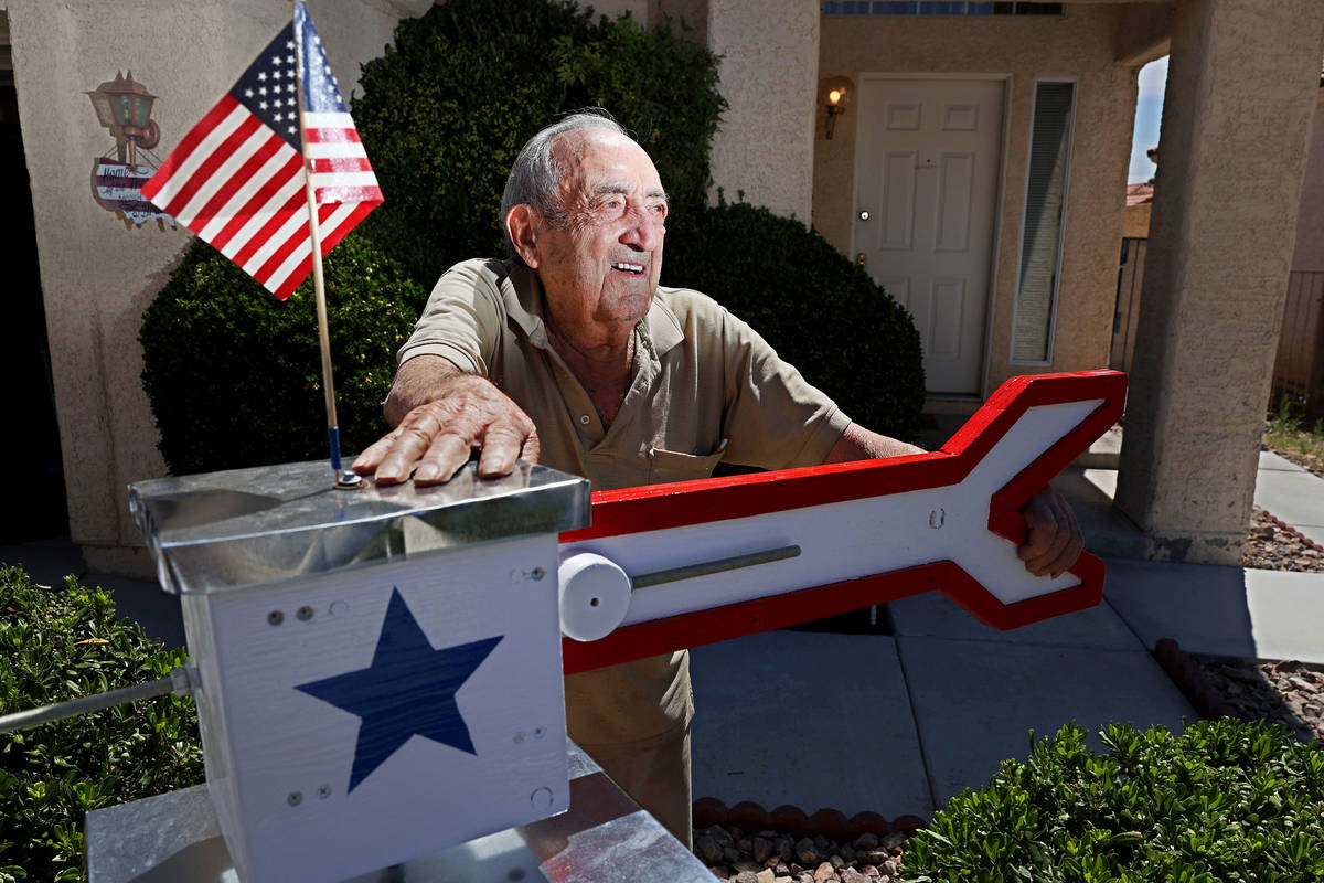 Onofrio "No-No" Zicari, 97, a World War II veteran, poses in front of a windmill his ...