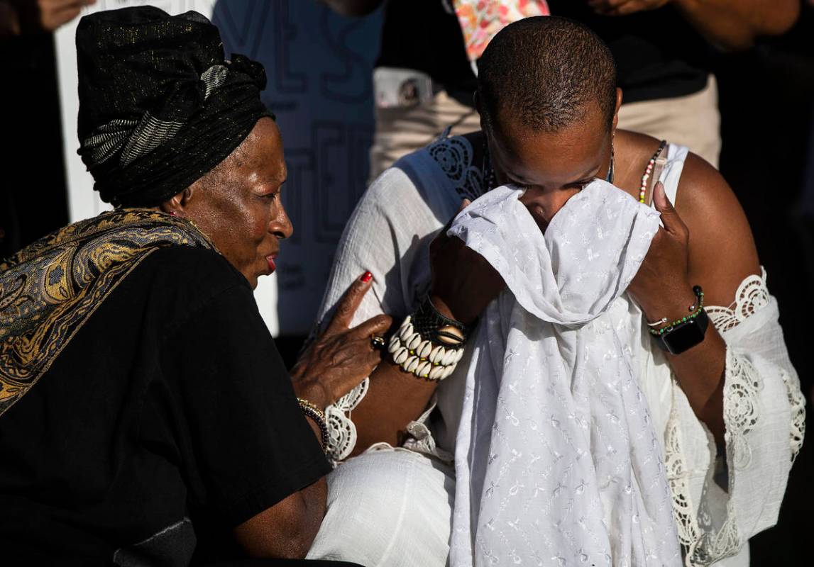 Nicole Palacio, right, is comforted by Alicent Kwateng during at a Black Lives Matter event at ...