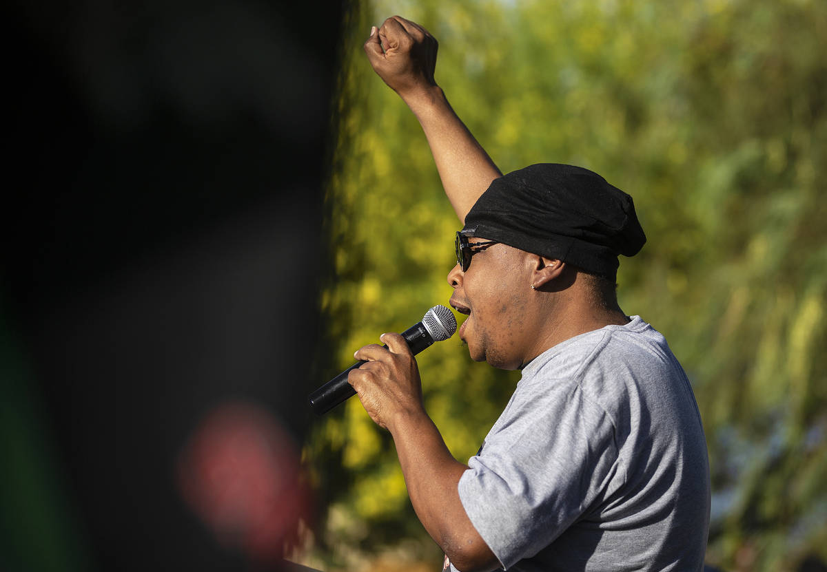 Community activist Lou Colllins addresses thousands of people who showed up at a Black Lives Ma ...