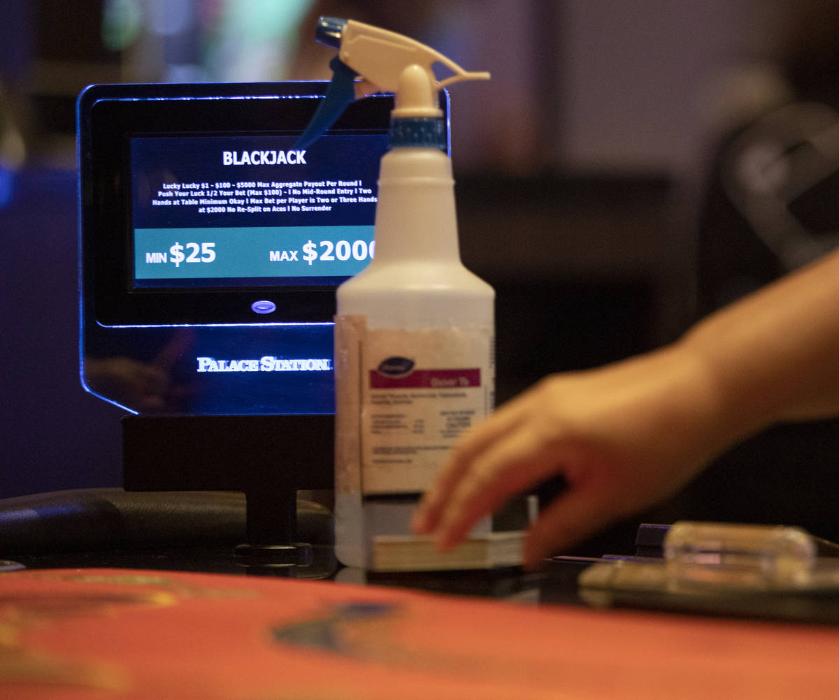 A bottle of cleaning spray sits at every blackjack table for dealers to clean in between rounds ...