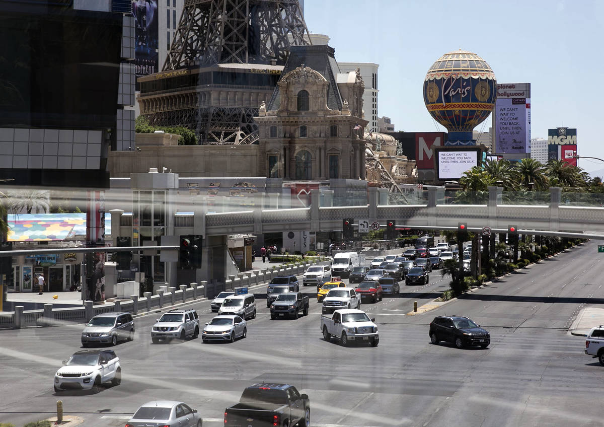 Motorists are seen at the intersection of Las Vegas Boulevard and Flamingo Road on Sunday, June ...
