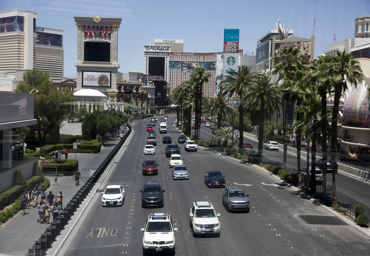 Pedestrians, left, and motorists on Las Vegas Boulevard on Sunday, June 7, 2020, in Las Vegas. ...