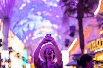 Las Vegas local Jess Medina takes an excited selfie as he visits Fremont Street Experience for ...