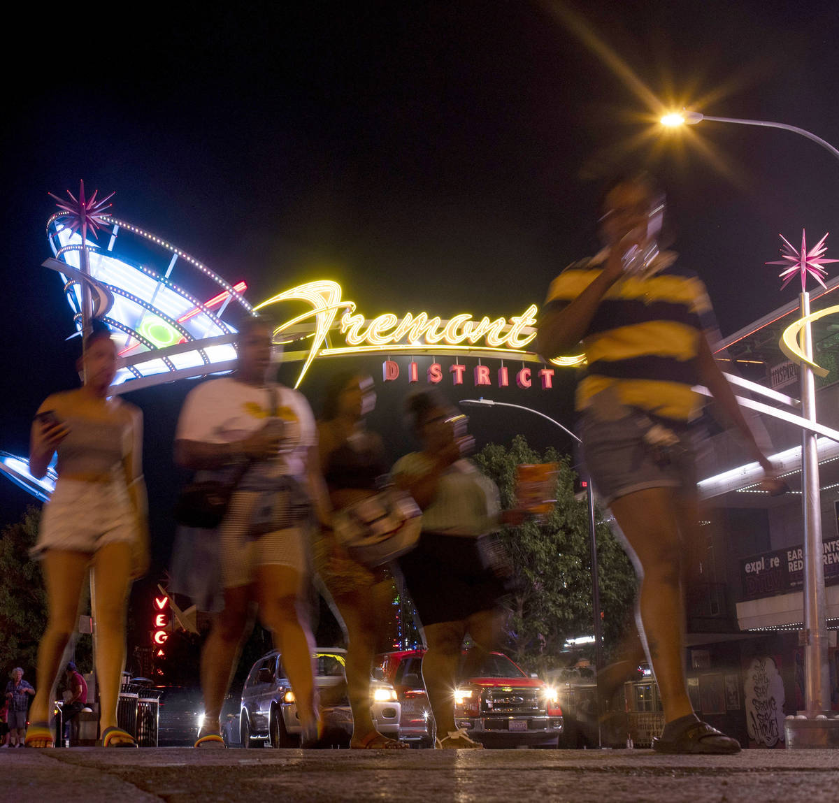 Pedestrians make way from Fremont District East into Fremont Street Experience as Phase Two of ...