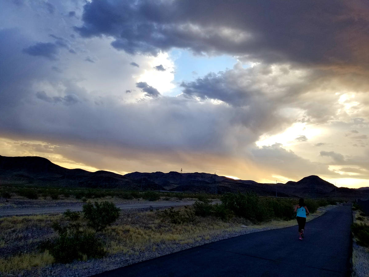 A runner hits the Burkholder Trail pavement in the early morning of June 3. (Natalie Burt)