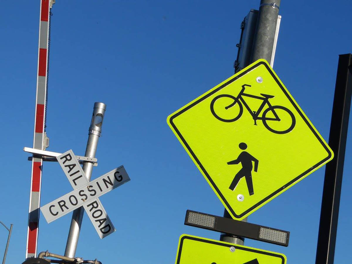 Signs encourage safe crossing at Horizon Drive to reconnect riders with the Union Pacific Railr ...