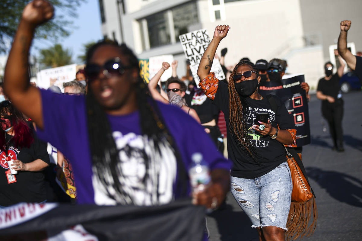 People participate in a march held by the Forced Trajectory Project for families who have been ...