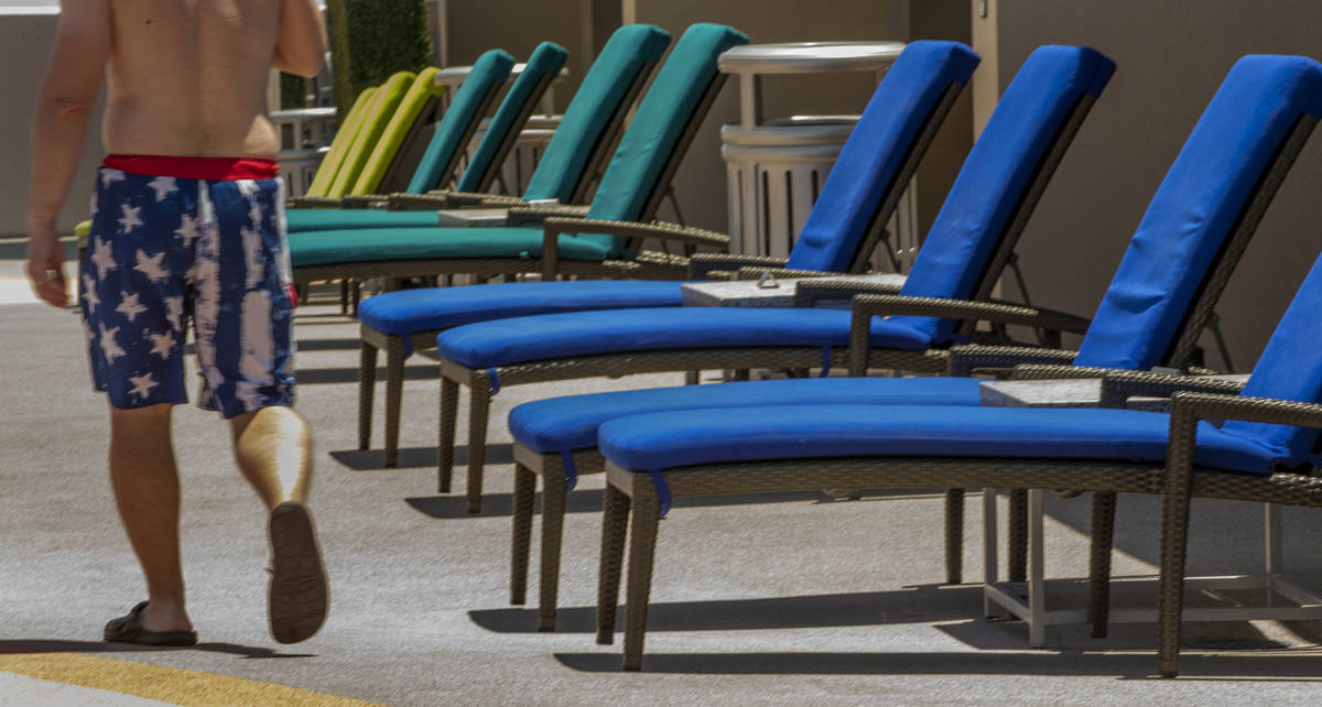 The colorful lounge chairs are set out for guests about the pool at The Strat on Saturday, June ...