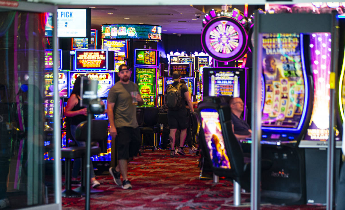 People walk the casino floor at the D Las Vegas at the Fremont Street Experience in downtown La ...