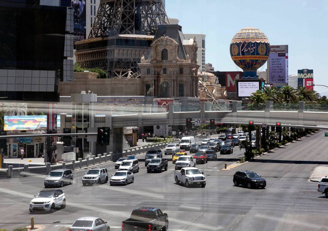 Motorists are seen at the intersection of Las Vegas Boulevard and Flamingo Road on Sunday, June ...