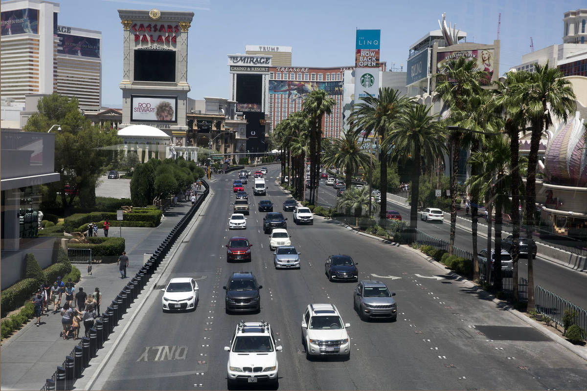 Pedestrians, left, and motorists on Las Vegas Boulevard on Sunday, June 7, 2020, in Las Vegas. ...