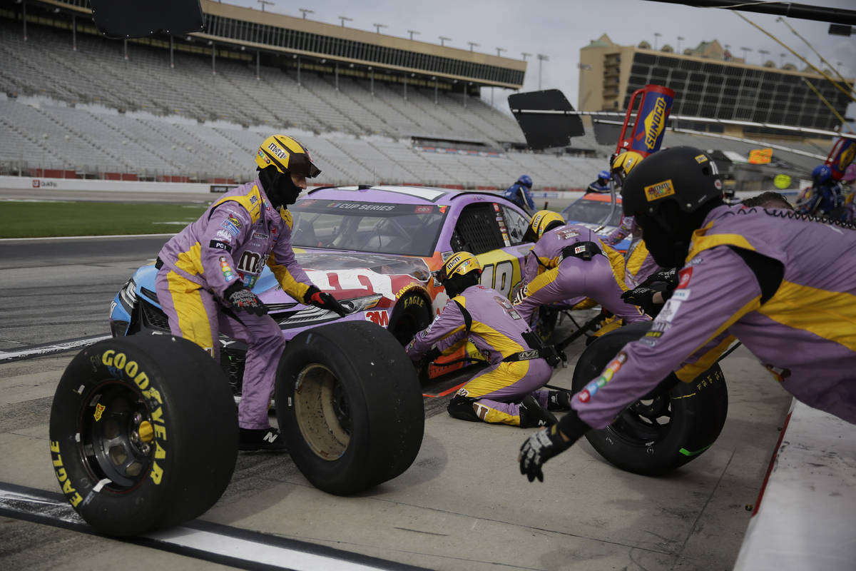 Kyle Busch makes a pit stop during the NASCAR Cup Series auto race at Atlanta Motor Speedway on ...