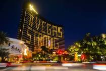 Traffic on the Strip passes by signage on Wynn Las Vegas showing support for the city during th ...