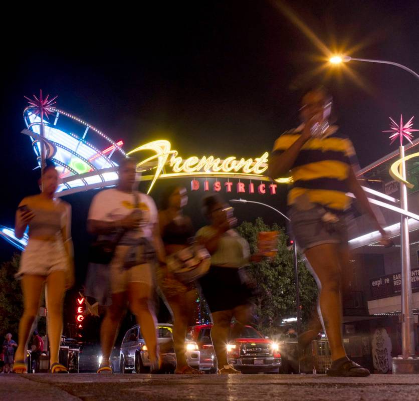 Pedestrians make way from Fremont District East into Fremont Street Experience as Phase Two of ...
