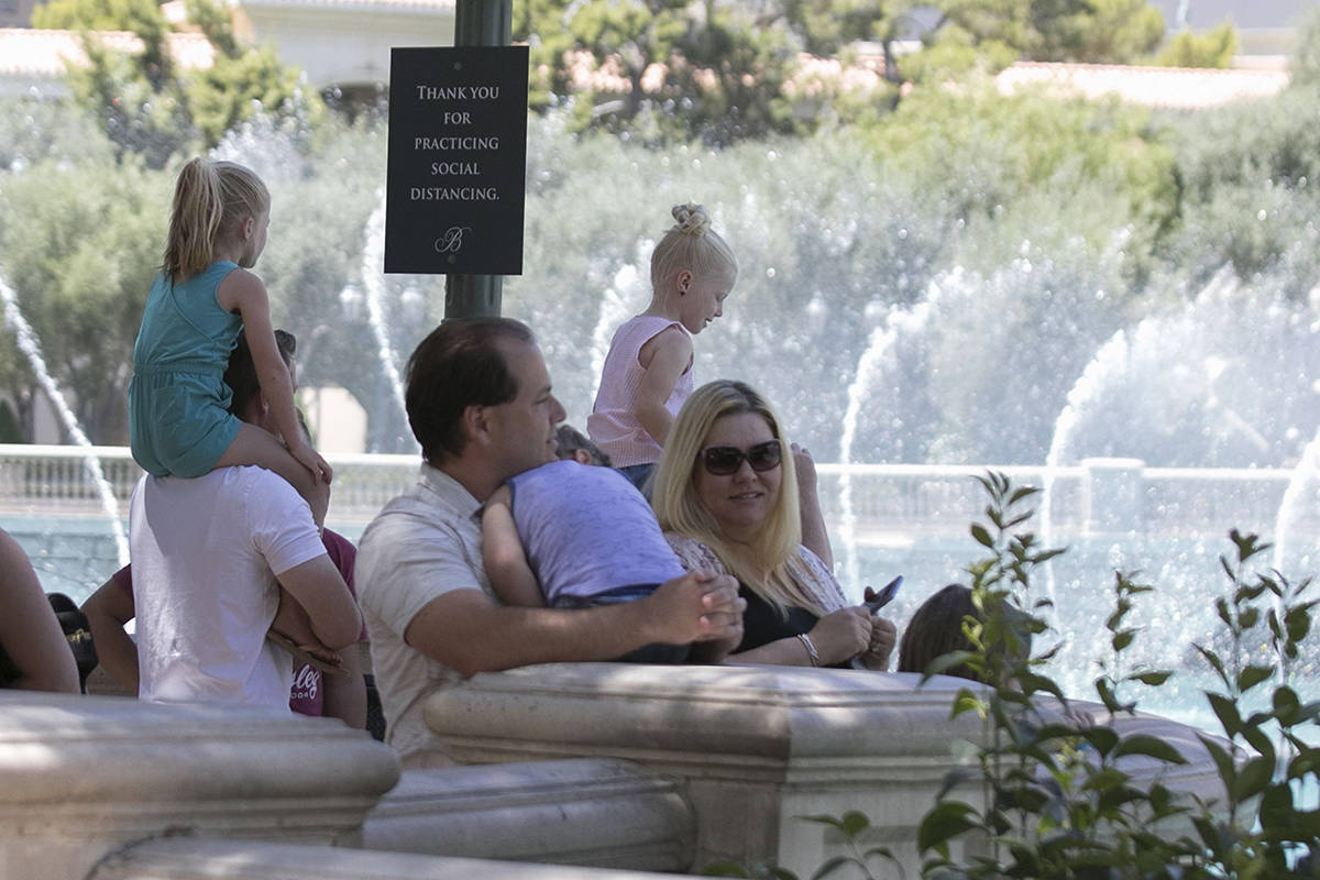 Tourists watch the Bellagio fountain show on Sunday, June 7, 2020, in Las Vegas. On Sunday, bot ...