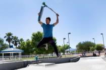 Izaiah Marure, 14, does a trick with his scooter at Duck Creek Skate Park in Las Vegas on Monda ...