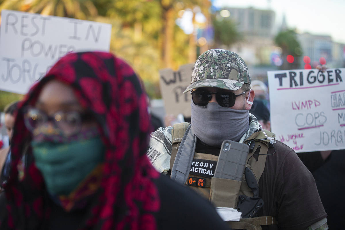 Protesters march north on the Strip during a vigil/walk for Jorge Gomez, who was fatally shot l ...