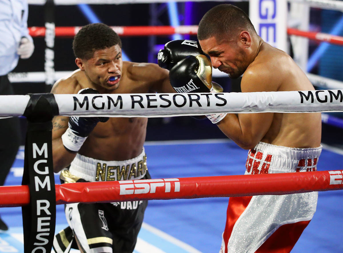 Shakur Stevenson, left, hits Felix Caraballo during their super featherweight fight Tuesday nig ...