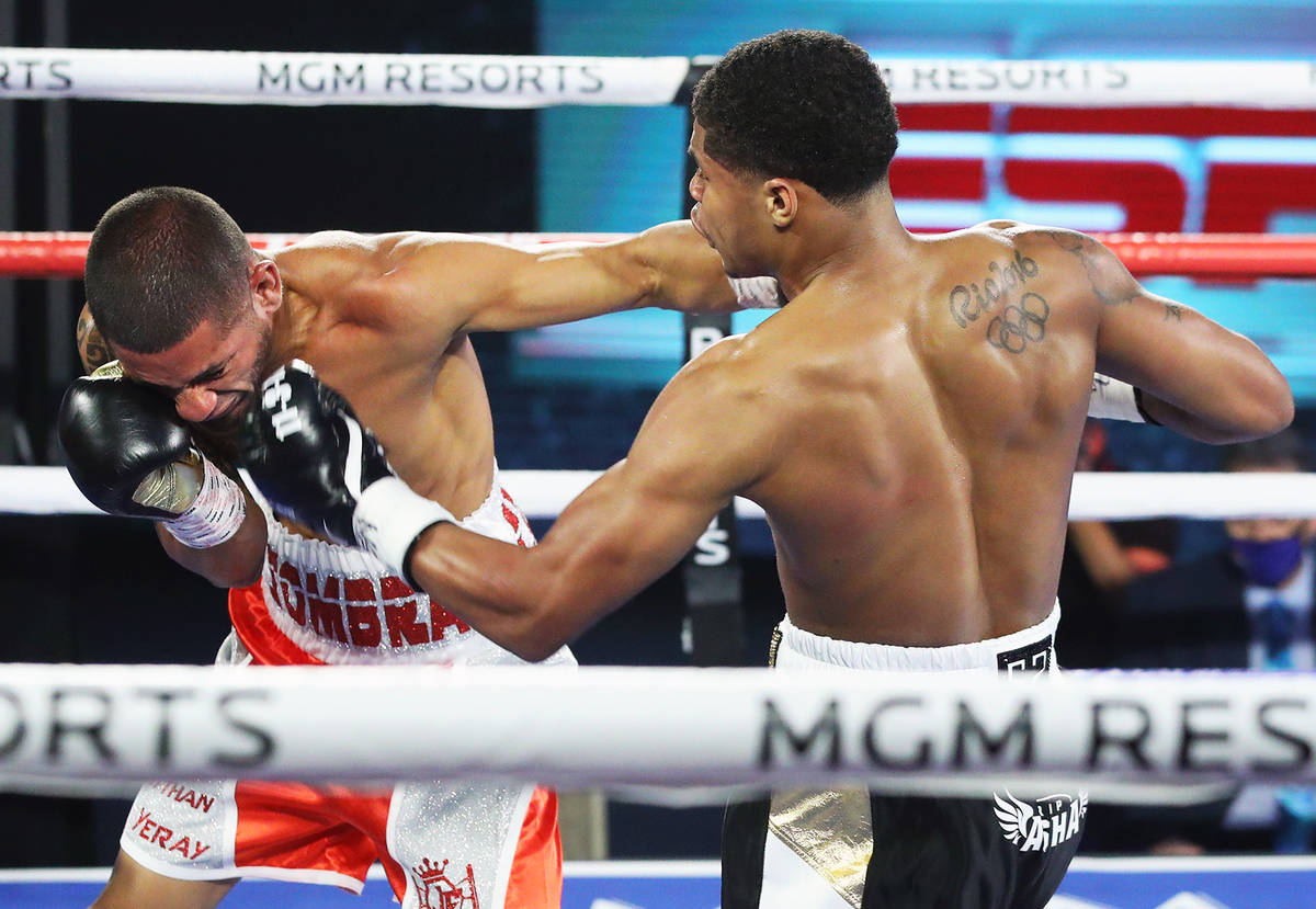 Shakur Stevenson, right, hits Felix Caraballo during their super featherweight fight Tuesday ni ...