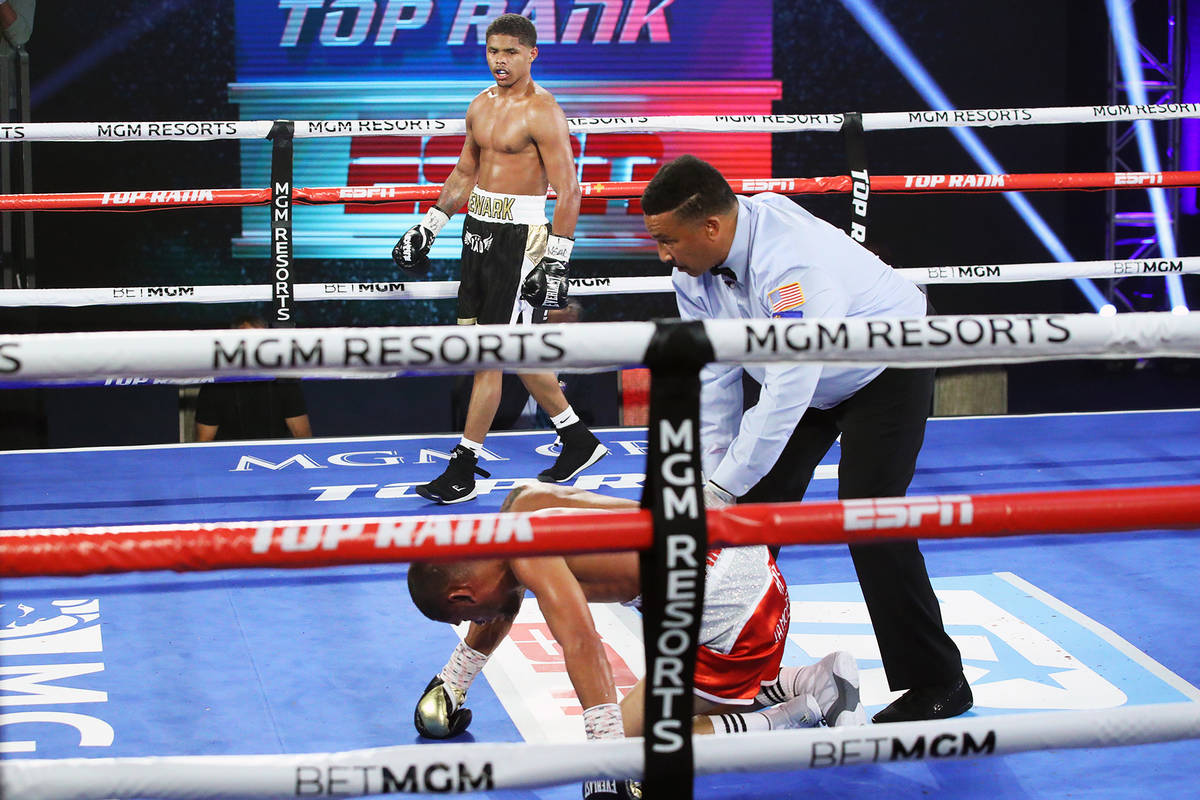 Shakur Stevenson knocks down Felix Caraballo during their super featherweight fight Tuesday nig ...