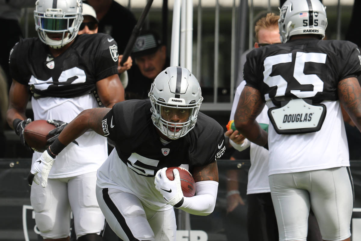 Oakland Raiders inside linebacker Brandon Marshall (54) runs with the football during the NFL t ...