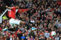 In this Sunday, Oct. 20, 2019 file photo Manchester United's Marcus Rashford scores his side's ...