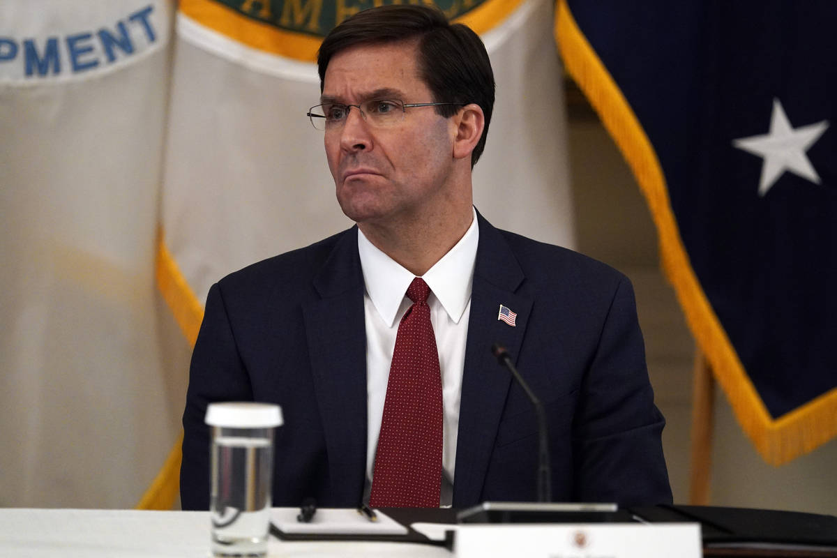 FILE - In this May 19, 2020, file photo Defense Secretary Mark Esper listens during a Cabinet M ...