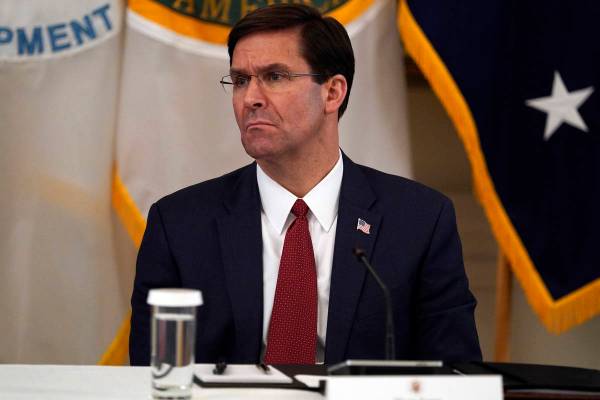 FILE - In this May 19, 2020, file photo Defense Secretary Mark Esper listens during a Cabinet M ...