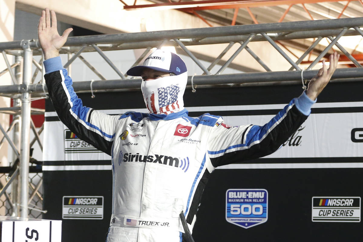 Martin Truex Jr. celebrates after winning a NASCAR Cup Series auto race Wednesday, June 10, 202 ...