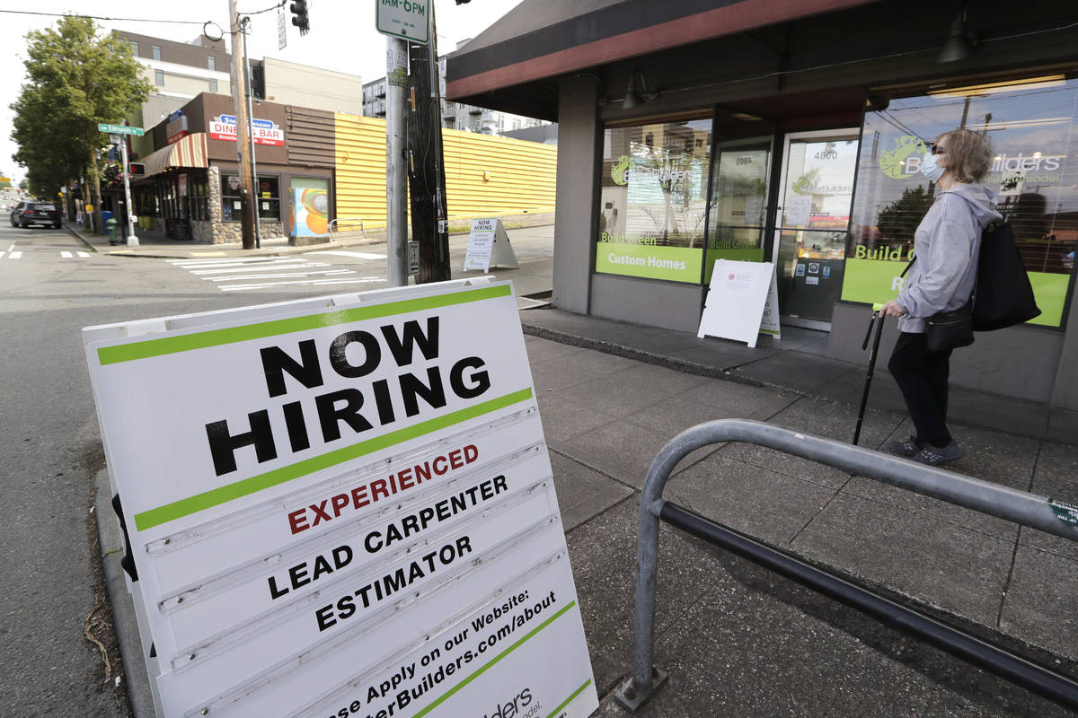 A reader board advertises a job opening for a remodeling company, in Seattle, June 4, 2020. The ...