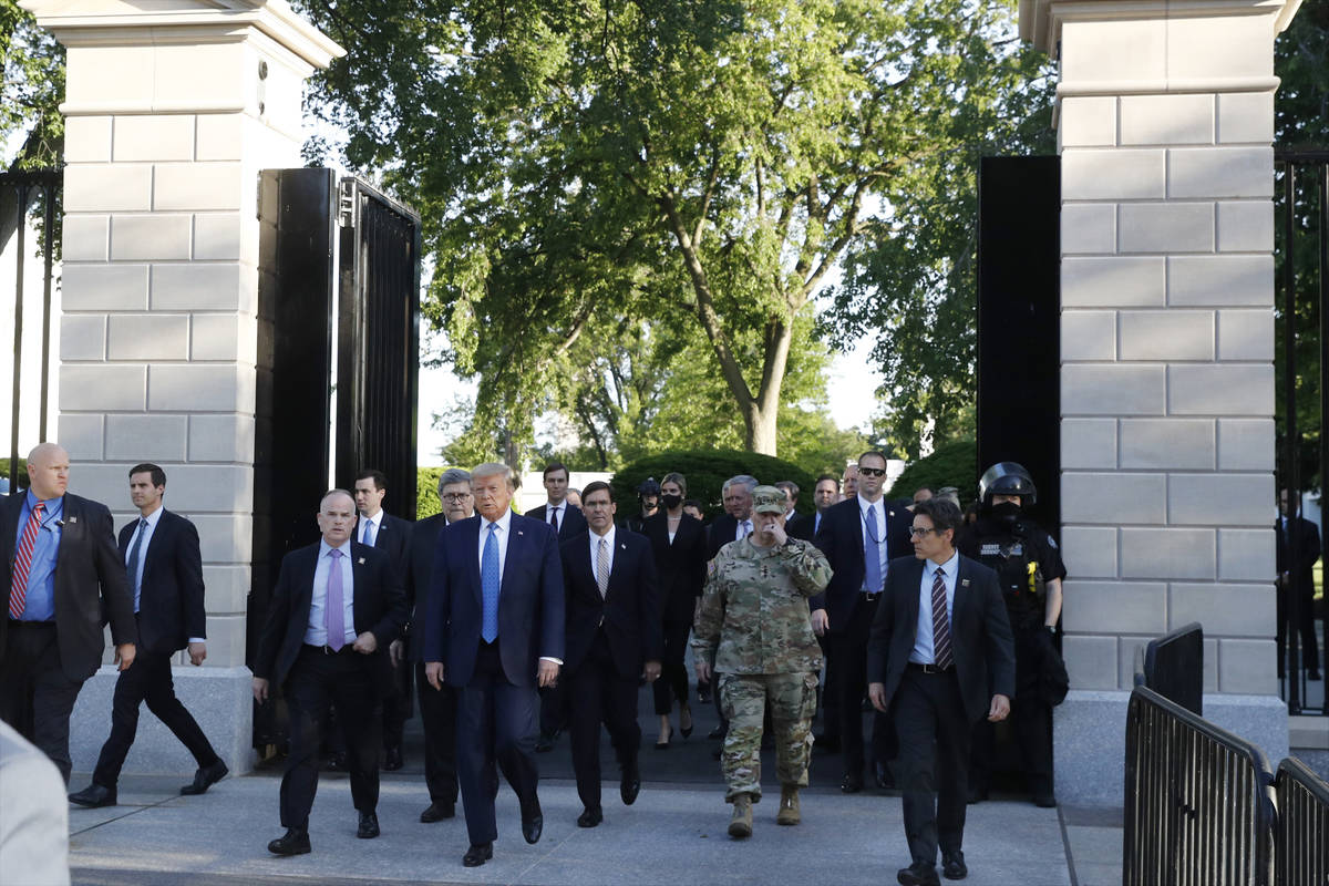 President Donald Trump walks from the gates of the White House to visit St. John's Church acros ...