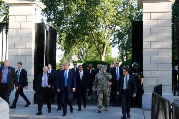 President Donald Trump walks from the gates of the White House to visit St. John's Church acros ...