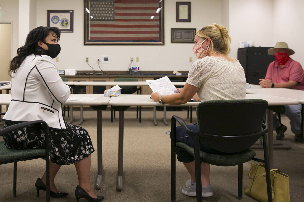 Stacey Campbell, left, chief deputy clerk at City of Las Vegas, and Molly Taylor, Expel Michele ...