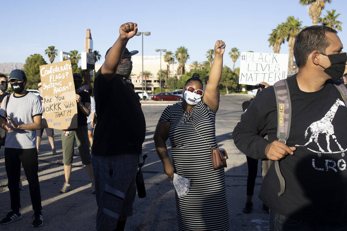 Married couple Kevin Johnson, left, and Angel Johnson, right, both born and raised Las Vegans, ...