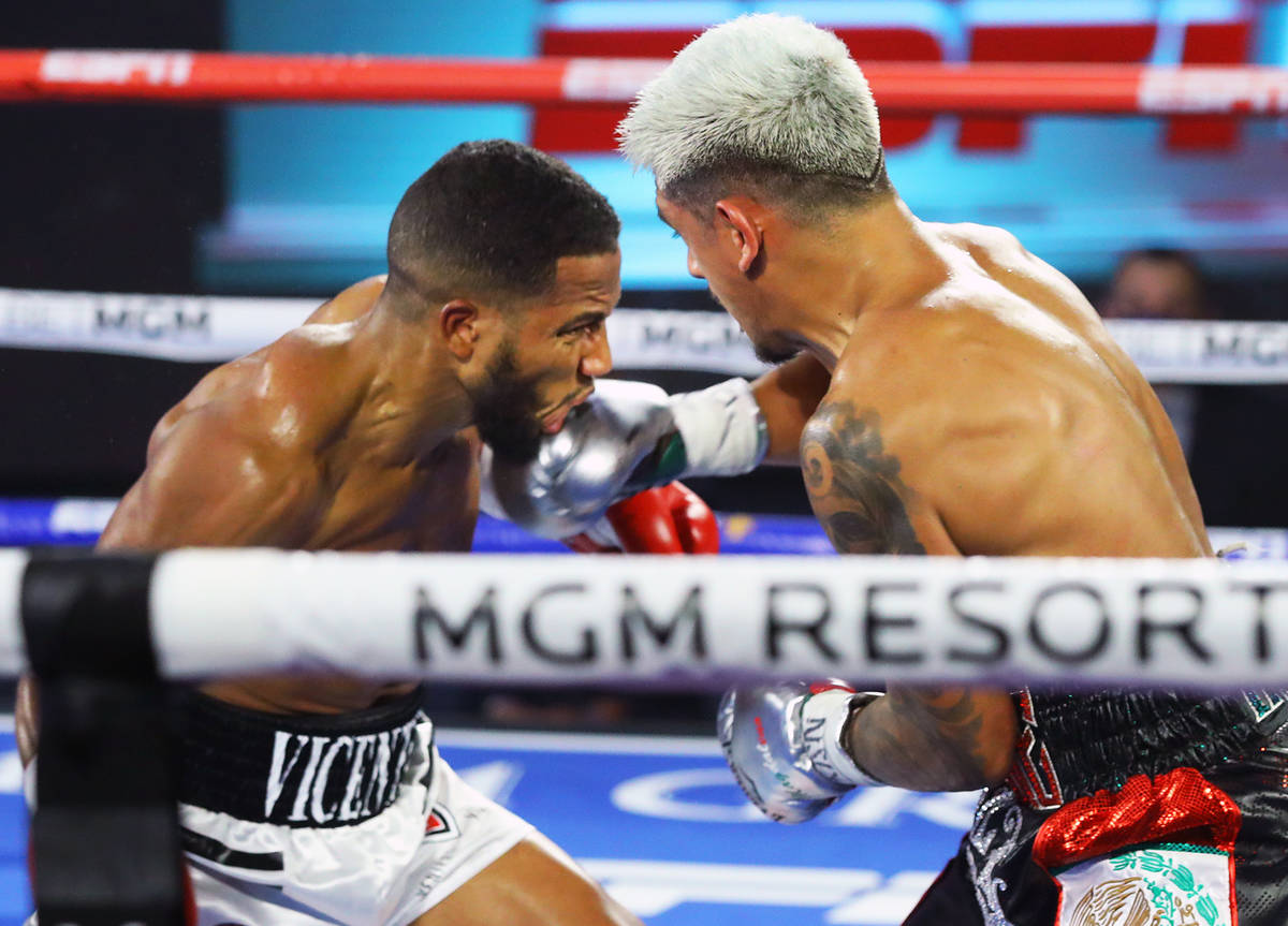 Jessie Magdaleno, right, lands a punch against Yenifel Vicente during their featherweight fight ...