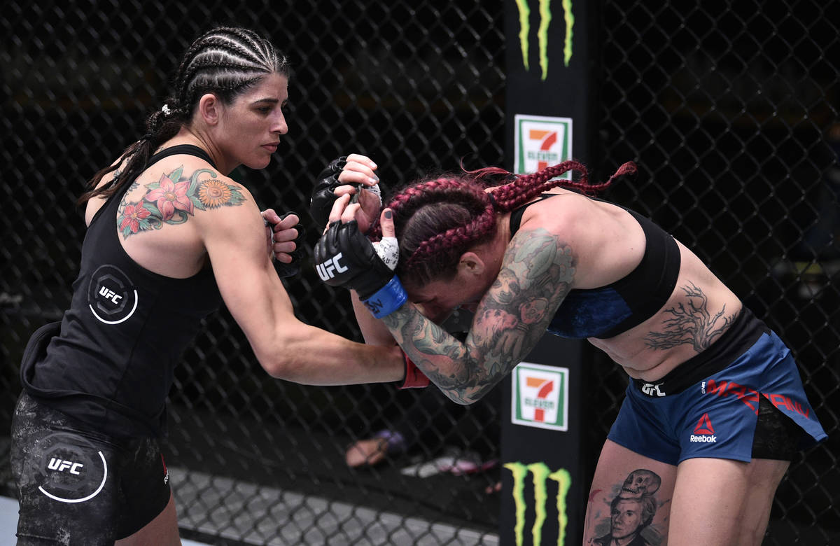 LAS VEGAS, NEVADA - JUNE 13: (L-R) Julia Avila punches Gina Mazany in their bantamweight fight ...