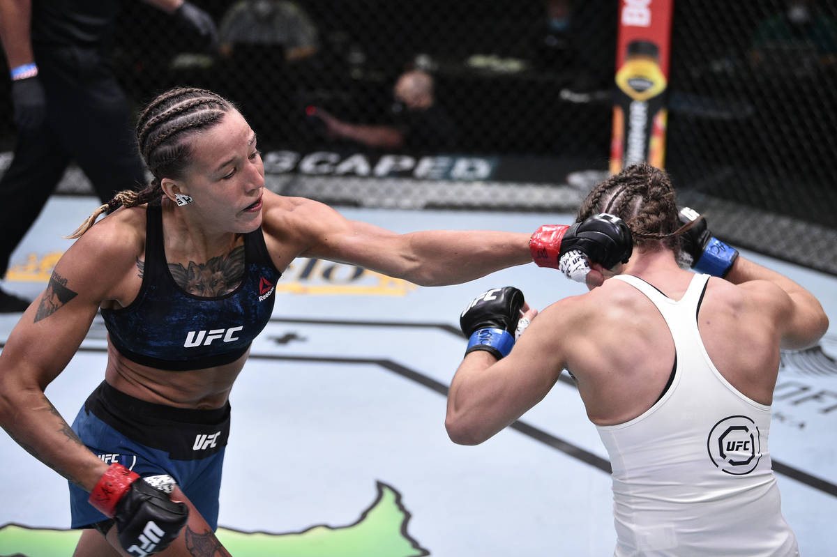 LAS VEGAS, NEVADA - JUNE 13: (L-R) Mariya Agapova of Kazakhstan punches Hannah Cifers in their ...