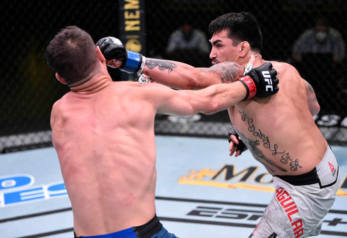 LAS VEGAS, NEVADA - JUNE 13: (R-L) Kevin Aguilar punches Charles Rosa in their lightweight figh ...