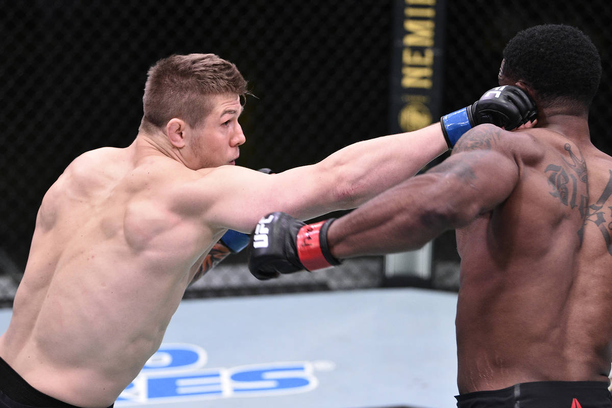 LAS VEGAS, NEVADA - JUNE 13: (L-R) Marvin Vettori of Italy punches Karl Roberson in their middl ...