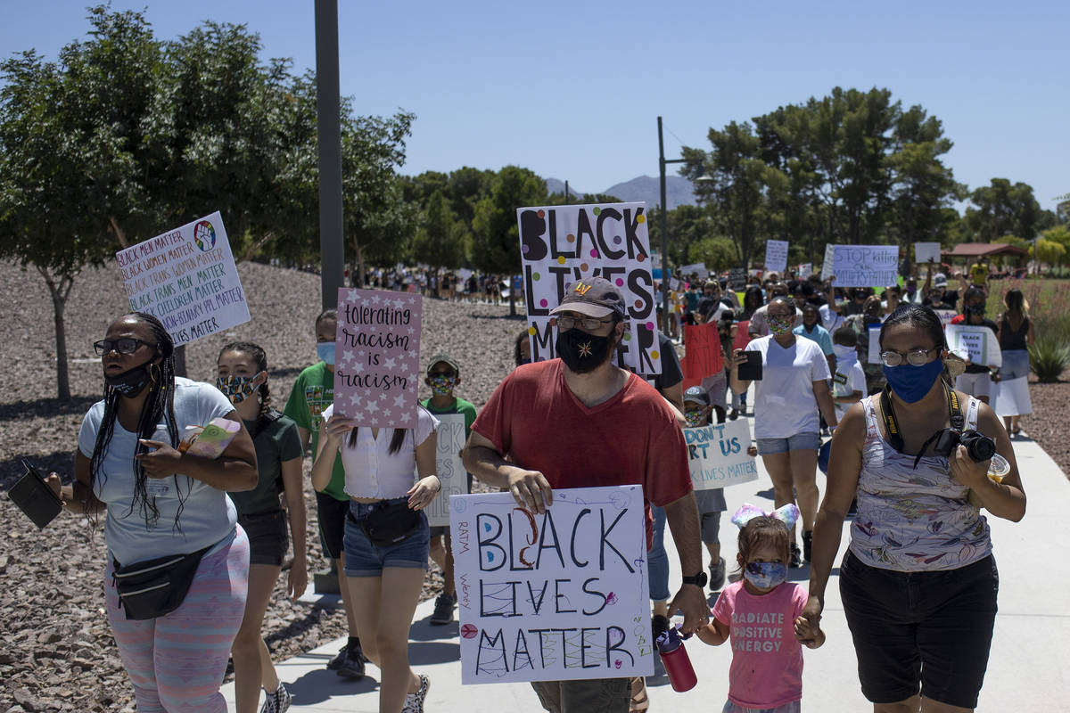 The "Kids Against Racism Rally" marches through Craig Ranch Regional Park on Sunday, ...