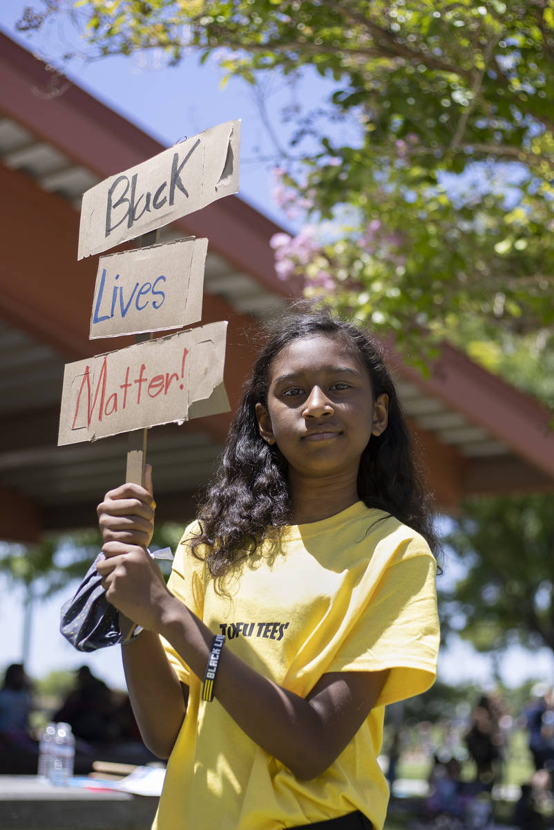 Kumei Tenorio-Norwood, 11, poses for a portrait following the "Kids Against Racism Rally,& ...