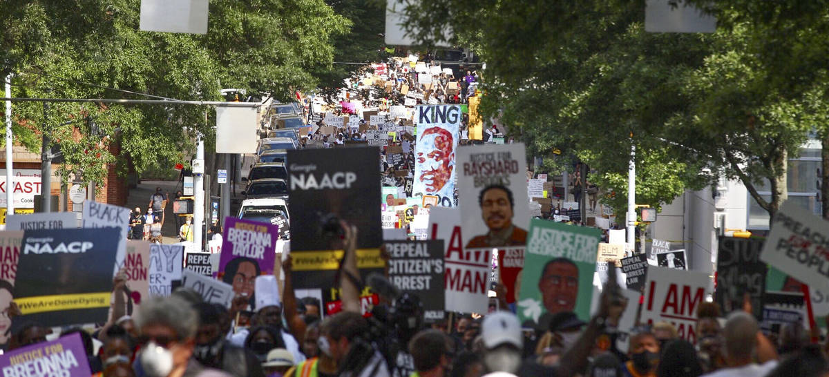 A crowd of demonstrators march to the Capitol Monday, June 15, 2020 in Atlanta. The NAACP march ...