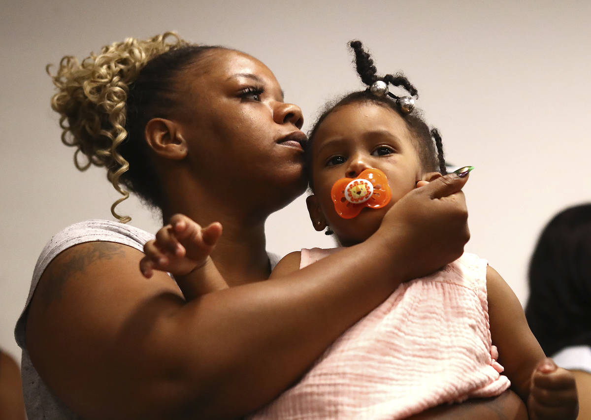 Tomika Miller, the wife of Rayshard Brooks, holds their daughter Memory, 2, during the family p ...