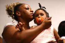 Tomika Miller, the wife of Rayshard Brooks, holds their daughter Memory, 2, during the family p ...