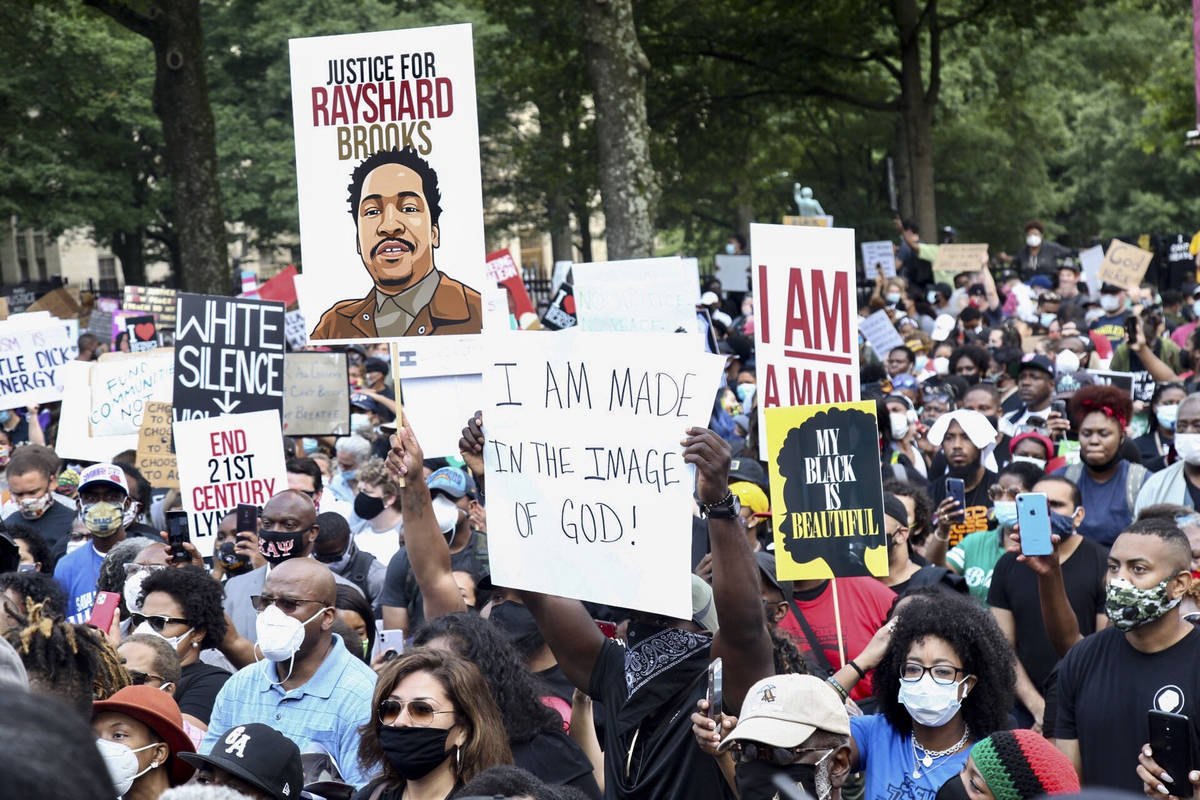 A crowd of demonstrators march to the Capitol Monday, June 15, 2020 in Atlanta. The NAACP March ...