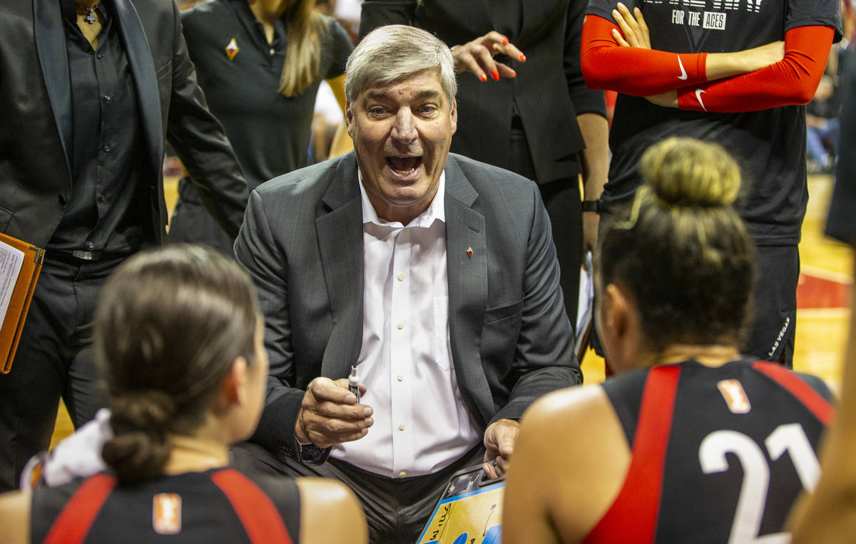 Las Vegas Aces head coach Bill Laimbeer talks up his players in a huddle during a timeout as th ...