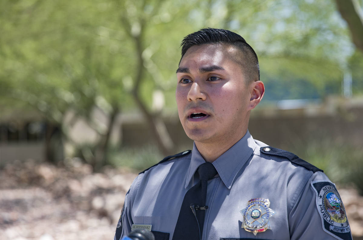 Nevada Highway Patrol Trooper Rafael Rodriguez speaks to the media about how he saved a woman w ...