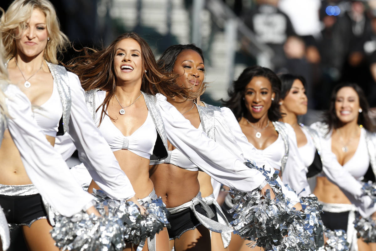 Oakland Raiders cheerleaders perform during the first half of an NFL football game between the ...